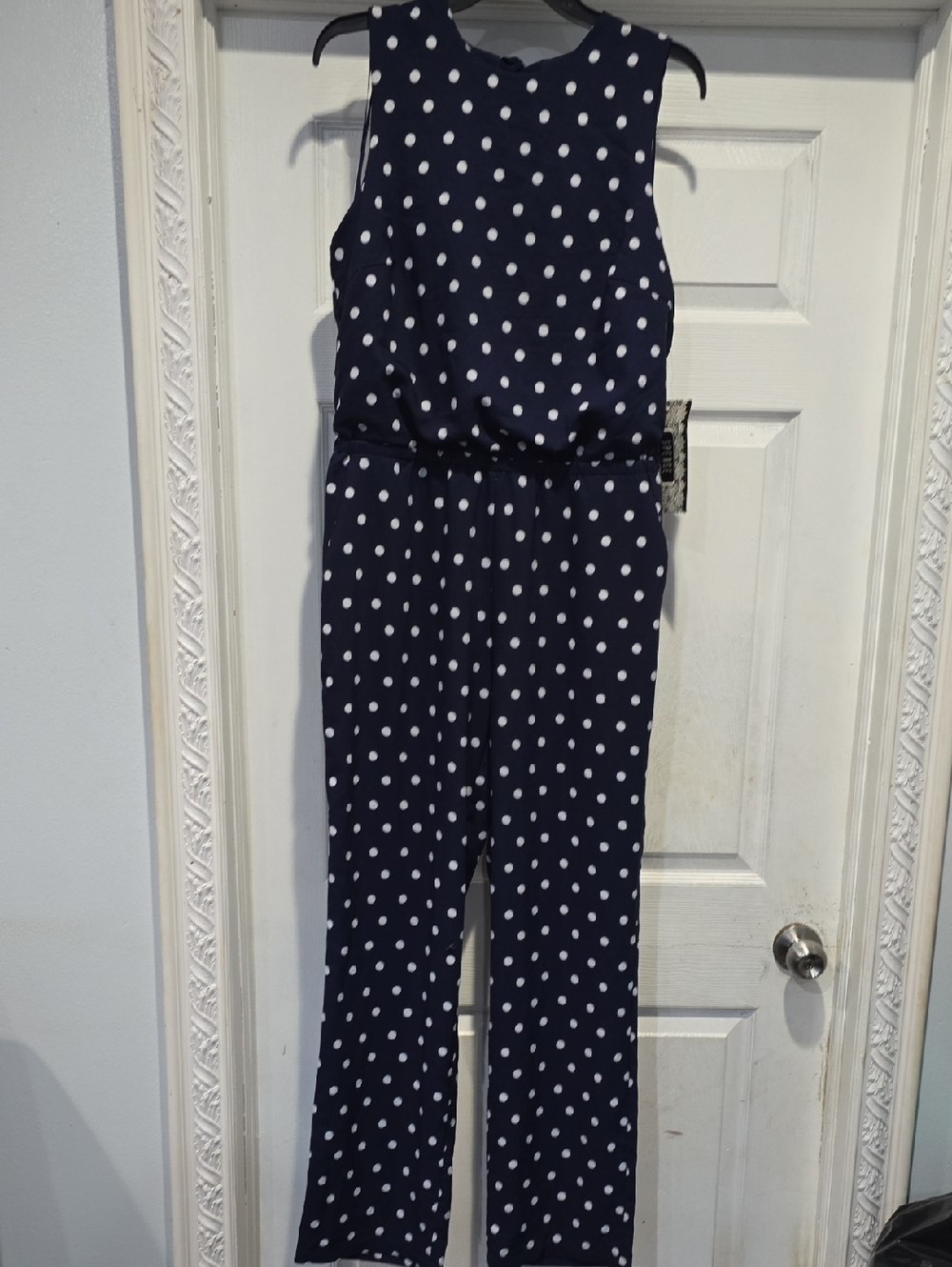Spencer's Navy Polka Dot Sleeveless Jumpsuit